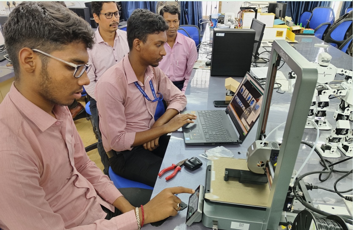 Students working with robotics equipment in an ECE laboratory